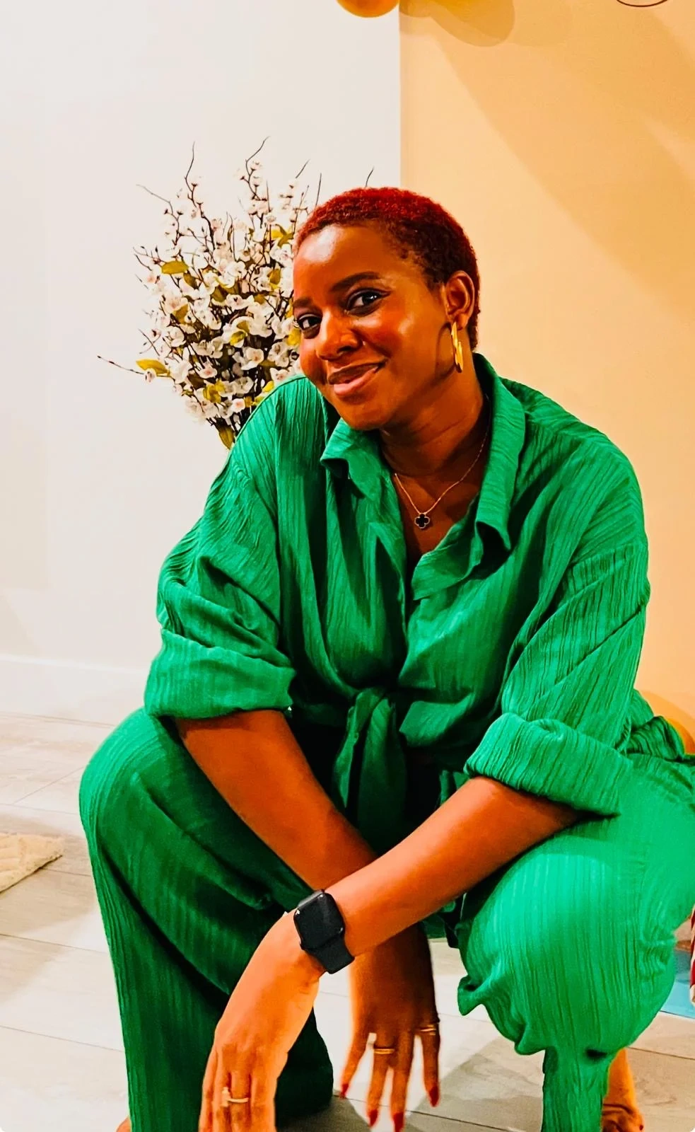 Mimi in a bright green outfit